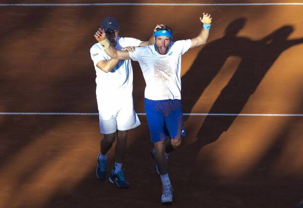 Argentina s Leonardo Mayer (R) celebrates with his captain Daniel Orsanic after the Davis Cup World Group first round singles match in Villa Martelli, near Buenos Aires, capital of Argentina, March 8, 2015. The match broke the record of duration with 6 hours and 42 minutes, as the longest match in the history of the Davis Cup. MartinxZabala) (da) (SP)ARGENTINA-VILLA MARTELLI-TENNIS-DAVIS CUP e MARTINxZABALA 