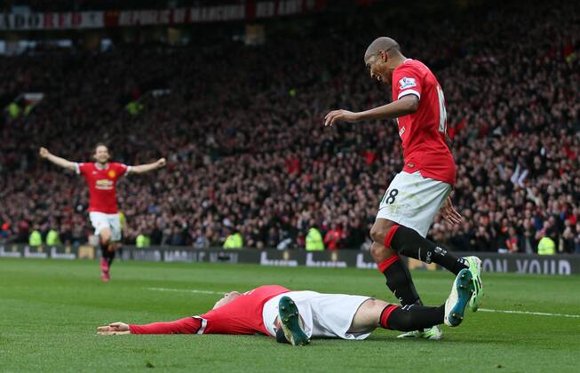 Wayne Rooney of Manchester United ManU celebrates scoring the third goal with a reference to a story that he had been knocked out in his kitchen while play boxing - Barclays Premier League - Manchester Utd vs Tottenham - Old Trafford Stadium - Manchester - England - 15th March 2015 - Picture Simon Bellis Sportimage EDITORIAL USE ONLY. No use with unauthorised audio, video, data, fixture lists, club league logos or live services. Online in-match use limited to 120 images, no video emulation. No use in betting, games or single club league player publications.