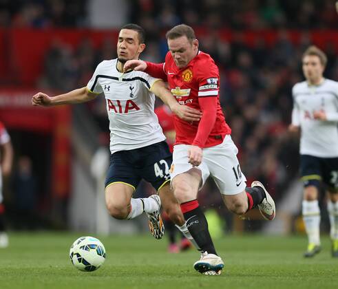 Wayne Rooney of Manchester United ManU tussles with Nabil Bentaleb of Tottenham - Barclays Premier League - Manchester Utd vs Tottenham - Old Trafford Stadium - Manchester - England - 15th March 2015 - Picture Simon Bellis Sportimage EDITORIAL USE ONLY. No use with unauthorised audio, video, data, fixture lists, club league logos or live services. Online in-match use limited to 120 images, no video emulation. No use in betting, games or single club league player publications.