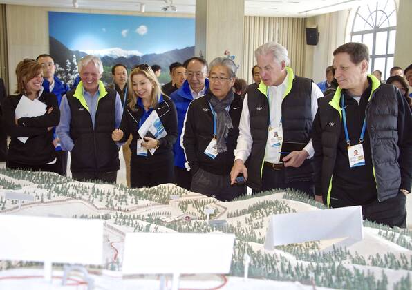 (150325) -- BEIJING, March 25, 2015 -- Members of the 2022 Evaluation Commission of the International Olympic Committee (IOC) check the sand box of stadiums in Beijing on March 25, 2015. The International Olympic Committee (IOC) team is visiting Beijing this week to assess its bid to host the Games ahead of a July vote that the Chinese capital -- which hosted the spectacular 2008 summer Games. ) (SP)CHINA-BEIJING-IOC EVALUATION GongxLei