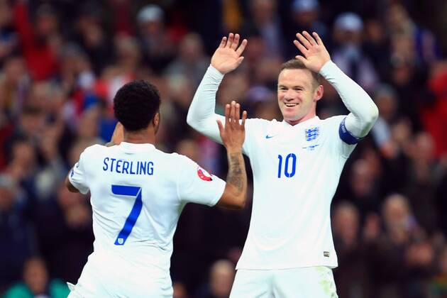 Wayne Rooney of England celebrates with goalscorer Raheem Sterling - England vs. Lithuania - UEFA EURO EM Europameisterschaft Fussball 2016 Qualifier - Wembley Stadium - London - 27 03 2015 Pic Philip Oldham Sportimage EDITORIAL USE ONLY. No use with unauthorised audio, video, data, fixture lists, club league logos or live services. Online in-match use limited to 120 images, no video emulation. No use in betting, games or single club league player publications.