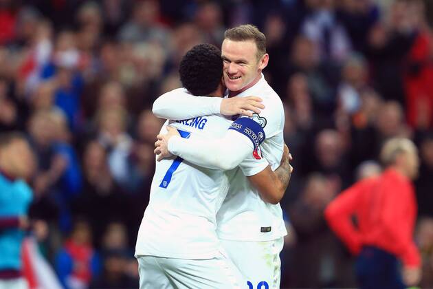 Wayne Rooney of England celebrates with goalscorer Raheem Sterling - England vs. Lithuania - UEFA EURO EM Europameisterschaft Fussball 2016 Qualifier - Wembley Stadium - London - 27 03 2015 Pic Philip Oldham Sportimage EDITORIAL USE ONLY. No use with unauthorised audio, video, data, fixture lists, club league logos or live services. Online in-match use limited to 120 images, no video emulation. No use in betting, games or single club league player publications.