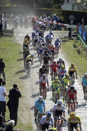 - ROUBAIX, FRANCE: Riders ride through a closed rail barrier at the Paris-Roubaix one day cycling race, 253,5 km from Compiegne to the Velodrome in Roubaix, Sunday 12 April 2015. DIRKxWAEM  x04603021x