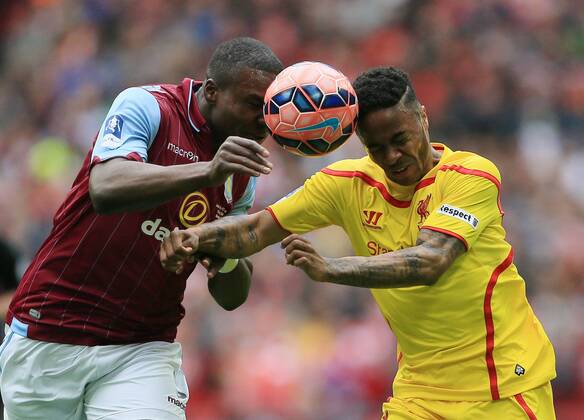 Aston Villa s Jores Okore tussles with Liverpool s Raheem Sterling The FA Cup - Semi Final- Aston Villa vs Liverpool - Wembley - England - 19th April 2015 - Picture David Klein Sportimage EDITORIAL USE ONLY. No use with unauthorised audio, video, data, fixture lists, club league logos or live services. Online in-match use limited to 120 images, no video emulation. No use in betting, games or single club league player publications.