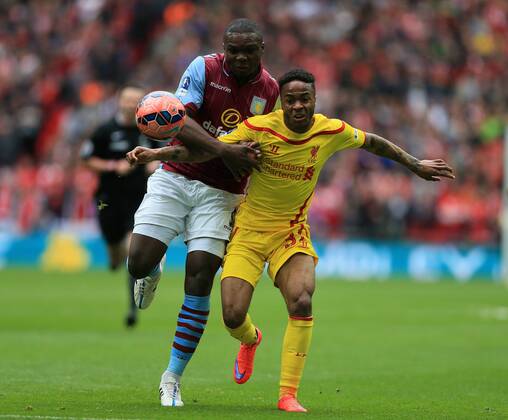 Aston Villa s Jores Okore tussles with Liverpool s Raheem Sterling The FA Cup - Semi Final- Aston Villa vs Liverpool - Wembley - England - 19th April 2015 - Picture David Klein Sportimage EDITORIAL USE ONLY. No use with unauthorised audio, video, data, fixture lists, club league logos or live services. Online in-match use limited to 120 images, no video emulation. No use in betting, games or single club league player publications.