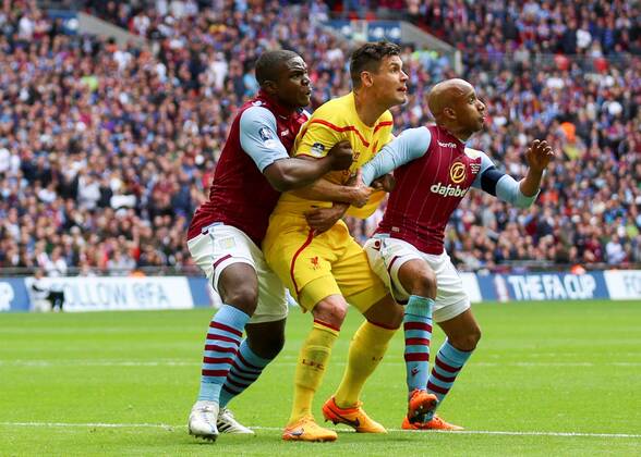 Football - 2014 2015 - FA Cup Semi Final, - Aston Villa Vs Liverpool, Aston Villa palyers double team on Liverpool s Dejan Lovren to defend a corner at Wembley Stadium COLORSPORT DANIEL BEARHAM  AST_LIV