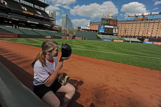 April 29, 2015 - Baltimore, MD, USA - Baltimore Orioles ball girl Emily Potere has no fans to give foul balls to during the team s game against the Chicago White Sox game on Wednesday, April 29, 2015, at Camden Yards in Baltimore. The game was closed to the public due to unrest in the city this week. MLB Baseball Herren USA 2015 - Baltimore Orioles Play In Empty Camden Yards - ZUMAm67_