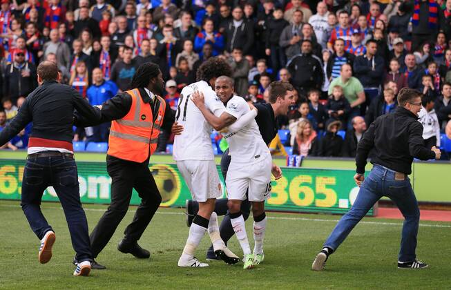 Manchester United ManU s Marouane Fellaini celebrates scoring his sides second goal as fans invade the pitch Barclays Premier League - Crystal Palace vs Manchester United- Selhurst Park - England - 9th May 2015 - Picture David Klein Sportimage EDITORIAL USE ONLY. No use with unauthorised audio, video, data, fixture lists, club league logos or live services. Online in-match use limited to 120 images, no video emulation. No use in betting, games or single club league player publications.