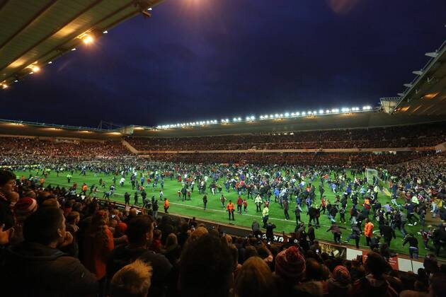 Fans invade the pitch at full time - Middlesbrough vs. Brentford - Skybet Championship - Play Off Second Leg - Riverside Stadium - Middlesbrough - 15 05 2015 Pic Philip Oldham Sportimage EDITORIAL USE ONLY. No use with unauthorised audio, video, data, fixture lists, club league logos or live services. Online in-match use limited to 120 images, no video emulation. No use in betting, games or single club league player publications.