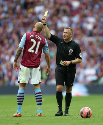 Alan Hutton of Aston Villa is shown a yellow card by referee Jon Moss - Arsenal vs. Aston Villa - FA Cup Final - Wembley Stadium - London - 30 05 2015 Pic Philip Oldham Sportimage EDITORIAL USE ONLY. No use with unauthorised audio, video, data, fixture lists, club league logos or live services. Online in-match use limited to 120 images, no video emulation. No use in betting, games or single club league player publications.