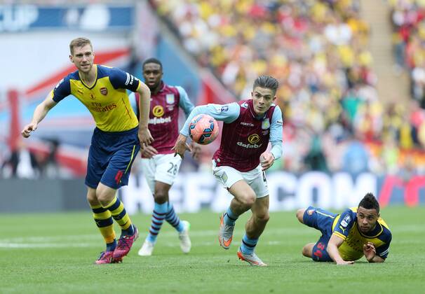 Arsenal s Per Mertesacker tussles with Aston Villa s Jack Grealish FA Cup Final - Arsenal vs Aston Villa - Wembley Stadium - England - 30th May 2015 - Picture David Klein Sportimage EDITORIAL USE ONLY. No use with unauthorised audio, video, data, fixture lists, club league logos or live services. Online in-match use limited to 120 images, no video emulation. No use in betting, games or single club league player publications.