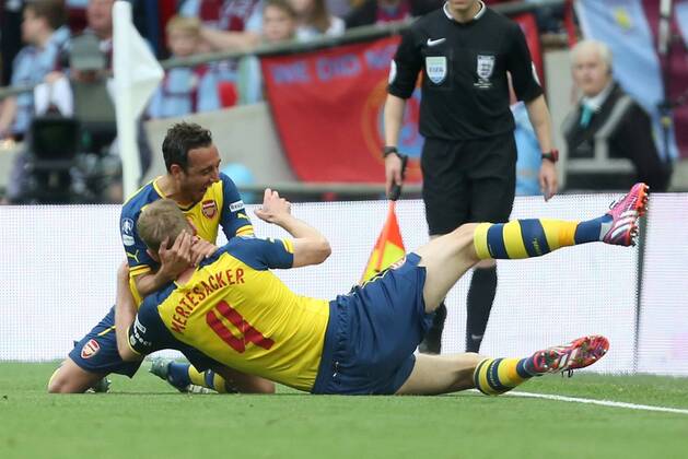 Arsenal s Per Mertesacker celebrates scoring his sides third goal - Arsenal vs. Aston Villa - FA Cup Final - Wembley Stadium - London - 30 05 2015 Pic Philip Oldham Sportimage EDITORIAL USE ONLY. No use with unauthorised audio, video, data, fixture lists, club league logos or live services. Online in-match use limited to 120 images, no video emulation. No use in betting, games or single club league player publications.