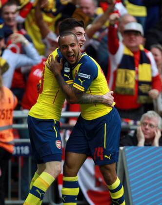 The FA Cup Final - Arsenal v Aston Villa . . London, UK . . 30.05.2015 Theo Walcott (A) celebrates scoring a goal for Arsenal with Hector Bellerin (A). 1-0