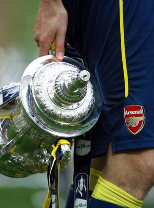 The FA Cup Final - Arsenal v Aston Villa . . London, UK . . 30.05.2015 Per Mertesacker (A) carries the trophy as Arsenal celebrate winning the FA Cup.