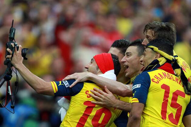 The FA Cup Final - Arsenal v Aston Villa . . London, UK . . 30.05.2015 Santi Cazorla takes a photograph with a remote camera as Arsenal celebrate winning the FA Cup.