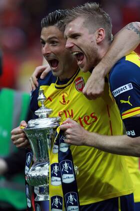 The FA Cup Final - Arsenal v Aston Villa . . London, UK . . 30.05.2015 Olivier Giroud (A) and Per Mertesacker (A) celebrate with the FA Cup.