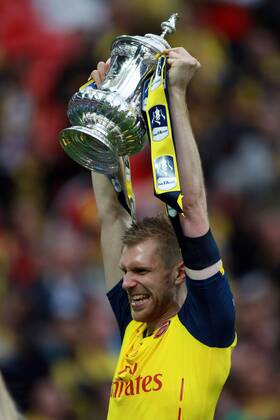 The FA Cup Final - Arsenal v Aston Villa . . London, UK . . 30.05.2015 Per Mertesacker (A) celebrates with the FA Cup.