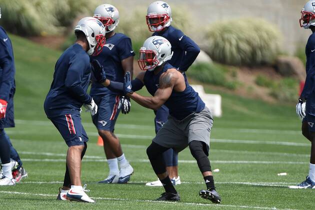 June 11, 2015 - Foxborough, Massachusetts, U.S. - New England Patriots corner back Malcolm Butler (21) (right) works with a member of the team during the organized team activities held on the practice fields at Gillette Stadium in Foxborough Massachusetts. Eric Canha CSM NFL American Football Herren USA 2015: Patriots OTA JUN 11 - ZUMAc04_