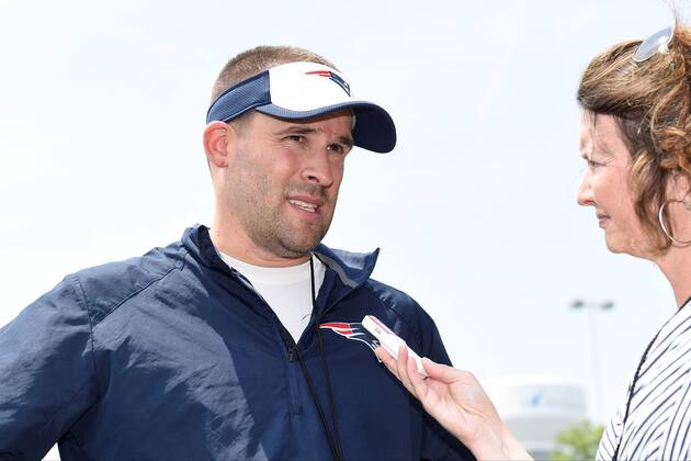 June 11, 2015 - Foxborough, Massachusetts, U.S. - New England Patriots offensive coordinator Josh McDaniels is interviewed by a reporter at the organized team activities held on the practice fields at Gillette Stadium in Foxborough Massachusetts. Eric Canha CSM NFL American Football Herren USA 2015: Patriots OTA JUN 11 - ZUMAc04_