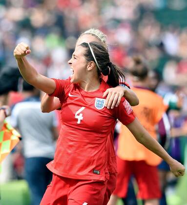 (150704) -- EDMONTON, July 4, 2015 -- England midfielder Fara Williams reacts with teammates after scoring on a penalty kick against Germany in extra time during the third place match of the FIFA 2015 Women s World Cup at Commonwealth Stadium, in Edmonton, Canada, on July 4, 2015. England defeated Germany 1-0 in extra time and won the third place of the FIFA 2015 Women s World Cup. ) (SP)CANADA-VANCOUVER-FIFA WOMEN S WORLD CUP-THIRD PLACE WangxYuguo 