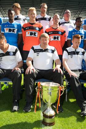 - GENT, BELGIUM: Gent s head coach Hein Vanhaezebrouck sits behind the champions trophy during the 2015-2016 season photo shoot of Belgian first league soccer team KAA Gent, Saturday 11 July 2015 in Gent. KURTxDESPLENTER x04662200x