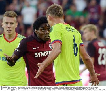Tiemoko Konate, of Sparta, left to right, and Aleksei Berezutski of CSKA Moscow discuss during the third qualifying round of the Champions League return match between AC Sparta Prague and CSKA Moscow in Prague, Czech Republic, on Wednesday, August 5, 2015. (CTKxPhoto MichalxDolezal) CTKPhotoP201508050851901  dol 013