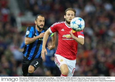 - MANCHESTER, UNITED KINGDOM: Club s Victor Vazquez Solsona and Manchester s Daley Blind fight for the ball during a soccer game between British club Manchester United ManU FC and Belgian team Club Brugge KV in Manchester, United Kingdom, Tuesday 18 August 2015, the first leg of the play-offs for the UEFA Champions League competition. BRUNOxFAHY x04682738x