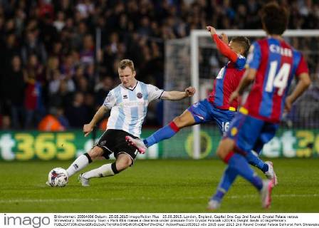 25.08.2015. London, England. Capital One Cup 2nd Round. Crystal Palace versus Shrewsbury. Shrewsbury Town s Mark Ellis makes a clearance under pressure from Crystal Palace& x2019;s Dwight Gayle xCraigxMercerx  ActionPlus11653613