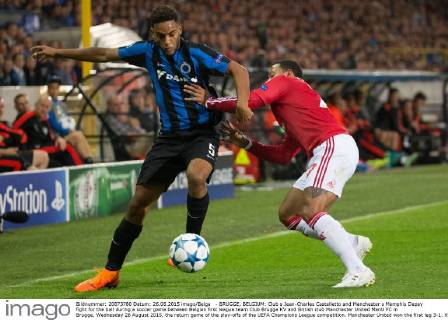 - BRUGGE, BELGIUM: Club s Jean-Charles Castelletto and Manchester s Memphis Depay fight for the ball during a soccer game between Belgian first league team Club Brugge KV and British club Manchester United ManU FC in Brugge, Wednesday 26 August 2015, the return game of the play-offs of the UEFA Champions League competition. Manchester United won the first leg 3-1. KURTxDESPLENTER x04687482x