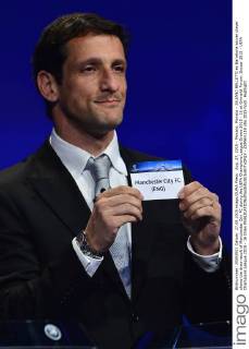 Aug. 27, 2015 - Monaco, Monaco - JULIANO BELLETTI ex Barcelona soccer player shows the draw result of Manchester City FC during the UEFA Champions League Draws 2015 - 16 at Grimaldi Forum. Soccer 2015 - UEFA Champions League 2015 - 16 Draw - ZUMAm119