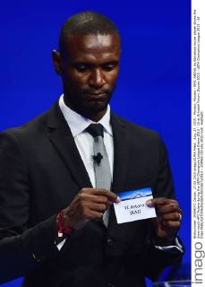 Aug. 27, 2015 - Monaco, Monaco - ERIC ABIDAL ex Barcelona soccer player shows the draw result ofFC Astana during the UEFA Champions League Draws 2015 - 16 at Grimaldi Forum. Soccer 2015 - UEFA Champions League 2015 - 16 Draw - ZUMAm119