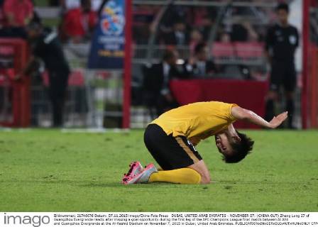 DUBAI, UNITED ARAB EMIRATES - NOVEMBER 07: (CHINA OUT) Zheng Long 27 of Guangzhou Evergrande reacts after missing a goal opportunity during the first leg of the AFC Champions League final match between Al Ahli and Guangzhou Evergrande at the Al-Rashid Stadium on November 7, 2015 in Dubai, United Arab Emirates.  CFP475533890