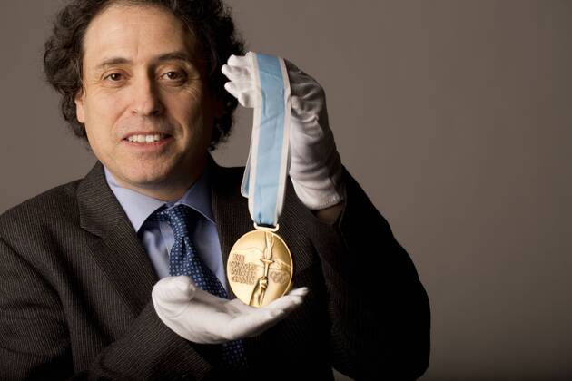 Jan. 15, 2016 - Toronto, ON, Canada - TORONTO, ON- JANUARY 15:.Robert Livingston photographed with Bo Berglund s 1980 Olympic silver medal that is up for auction.. Olymic memorabilia auction - ZUMAt14_