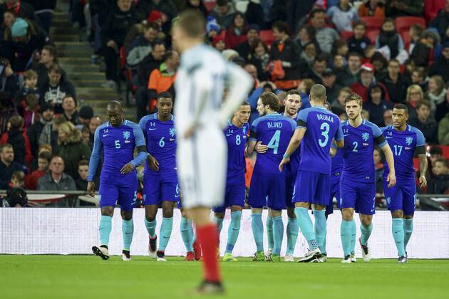 (L-R) Jetro Willems of Holland, Riechedly Bazoer of Holland, Jamie Vardy of England, Ibrahim Afellay of Holland, Daley Blind of Holland, Vincent Janssen of Holland, Jeffrey Bruma of Holland, Joel Veltman of Holland, Luciano Narsingh of Holland Maurice van Steen London England v Netherlands xVIxxIVx 5233694