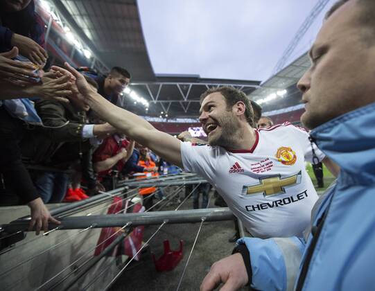 Manchester United ManU s Juan Mata celebrates with the fans during the Emirates FA Cup Final match at Wembley Stadium. Photo credit should read: David Klein Sportimage EDITORIAL USE ONLY. No use with unauthorised audio, video, data, fixture lists, club league logos or live services. Online in-match use limited to 120 images, no video emulation. No use in betting, games or single club league player publications.