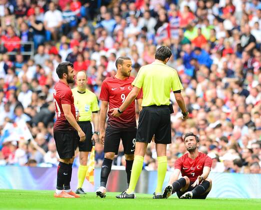 Friendly National football Match between England and Turkey at Etihad Stadium in Manchester , England on May 22, 2016. Pictured: Referee Deniz Aytekin and Volkan Sen (L), Cenk Tosun (C) , Gokhan Gonul of Turkey. 