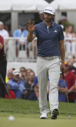 July 3, 2016 - Akron, OH, USA - Winner Dustin Johnson acknowledges applause after leaving his putt on the cup lip on the 18th hole on the final day of the Bridgestone Invitational golf tournament on Sunday, July 3, 2016, at Firestone Country Club in Akron, Ohio. Johnson bogied the hole but won the tournament by one stroke. Bridgestone Invitational - ZUMAm67_