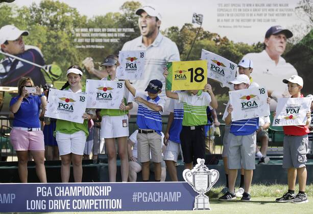 Fans hold up 18th hole flags to be signed by players at the PGA Golf Herren Championship at Baltusrol Golf Club in Springfield, New Jersey on July 26, 2016.  PGA20160726123 JOHNxANGELILLO