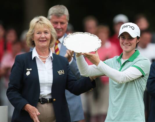 July 31, 2016 - Woburn, United Kingdom - Leona Maguire of Ireland is presented with the trophy for the leading amateur player by Diane Bailey The Presidient of the LGU during the final round of the 2016 Ricoh Women s British Open played at Woburn Golf and Country Club, Woburn on July 31st 2016. Ricoh Women s British Open 2016 Day Four  - ZUMAn230