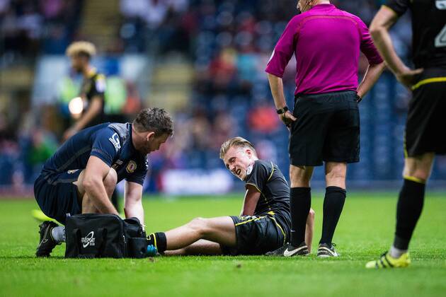 23.08.2016. Ewood Park, Blackburn, England. EFL Cup Football. Blackburn Rovers versus Crewe Alexandra. Crewe Alexandra midfielder George Cooper receives treatment. xTimxWilliamsx  ActionPlus11779526