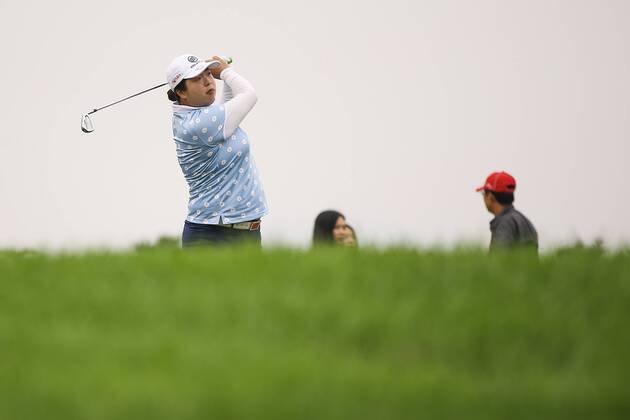 BEIJING, CHINA - SEPTEMBER 26: Feng Shanshan of China swings the club during a training session on Day one of 2016 Reignwood LPGA Golf Damen Classic at Reignwood Pine Valley on September 26, 2016 in Beijing, China.  CFP492737099
