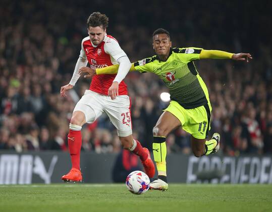 Arsenal s Carl Jenkinson tussles with Reading s Jordan Obita during the EFL Cup match at the Emirates Stadium, London. Picture date October 25th, 2016 Pic David Klein Sportimage EDITORIAL USE ONLY. No use with unauthorised audio, video, data, fixture lists, club league logos or live services. Online in-match use limited to 120 images, no video emulation. No use in betting, games or single club league player publications.