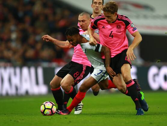 England v Scotland - FIFA World Cup WM Weltmeisterschaft Fussball 2018 Qualifier . . London, UK . . 11.11.2016 Scott Brown (S) Raheem Sterling (E) Christophe Berra (S) 