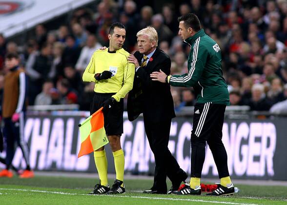11.11.2016. Wembley Stadium, London, England. World Cup Qualifying Football. England versus Scotland. Scotland Manager Gordon Strachan is asked by Fourth Official H& xfc;seyin G& xf6;& xe7;ek to refrain from touching Assistant referee Bahattin Duran during a discussion xMarkxKertonx  ActionPlus11808491
