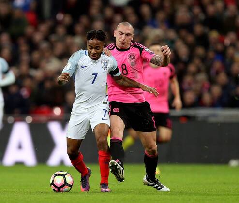 Raheem Sterling of England tackled by Scott Brown of Scotland during the FIFA World Cup WM Weltmeisterschaft Fussball Qualifying Group F match at Wembley Stadium, London. Picture date: November 11th, 2016. Pic David Klein Sportimage EDITORIAL USE ONLY. No use with unauthorised audio, video, data, fixture lists, club league logos or live services. Online in-match use limited to 120 images, no video emulation. No use in betting, games or single club league player publications.