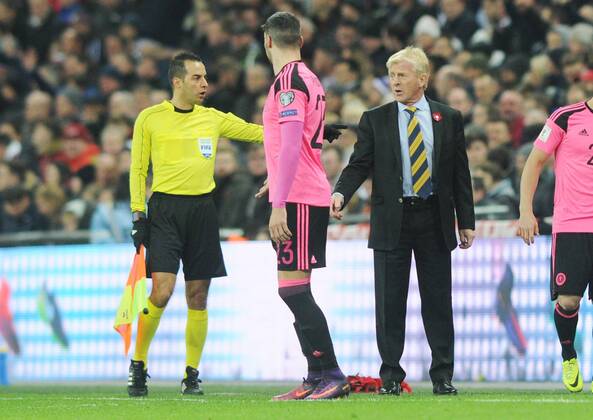 Football - 2016 2017 World Cup Qualifier - Group F: England vs. Scotland Scotland Manager Gordon Strachan is told to move back by the linesman at Wembley. COLORSPORT ANDREW COWIE 