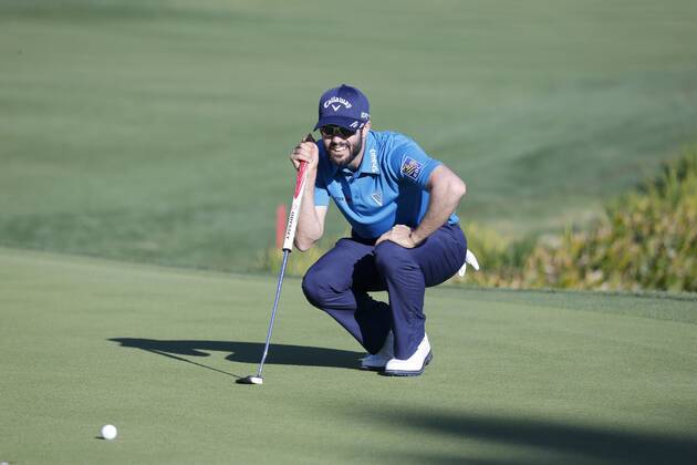 January 21, 2017 Adam Hadwin of Canada lines up a putt on the 18th hole during the third round of the CareerBuilder Challenge at La Quinta Country Club in La Quinta, California. CSM GOLF 2017: CareerBuilder Challenge JAN 21 - ZUMAc04_ 20170121_zaf_c04_346