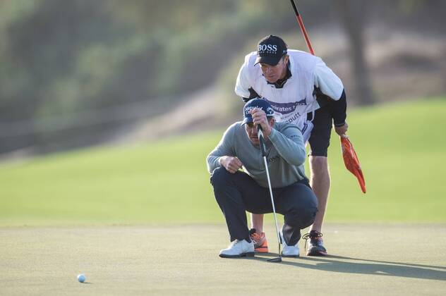 Henrik Stenson of Sweden and his caddy line up a putt in their second round during the PGA Golf Herren European Tour Dubai Desert Classic Tournament Day 3 at the Emirates Golf Club, Dubai, UAE on 4 February 2017. Copyright: xGrantxWinterx 14030061