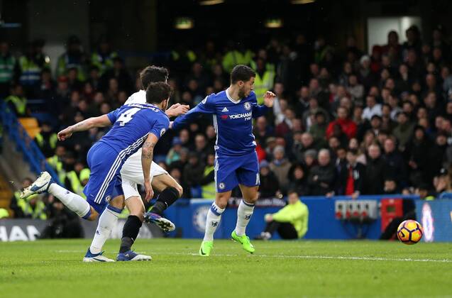 Chelsea s Cesc Fabregas scoring his sides opening goal during the Premier League match at the Stamford Bridge Stadium, London. Picture date February 25th, 2017 Pic David Klein Sportimage EDITORIAL USE ONLY. No use with unauthorised audio, video, data, fixture lists, club league logos or live services. Online in-match use limited to 120 images, no video emulation. No use in betting, games or single club league player publications.