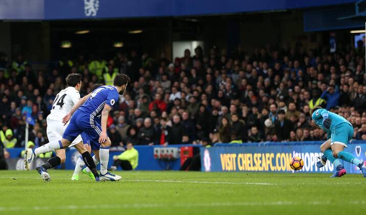 Chelsea s Cesc Fabregas scoring his sides opening goal during the Premier League match at the Stamford Bridge Stadium, London. Picture date February 25th, 2017 Pic David Klein Sportimage EDITORIAL USE ONLY. No use with unauthorised audio, video, data, fixture lists, club league logos or live services. Online in-match use limited to 120 images, no video emulation. No use in betting, games or single club league player publications.